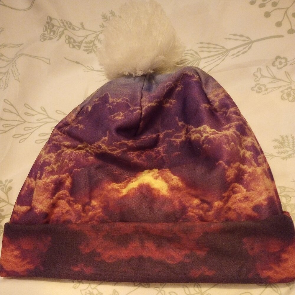 Beanie Hat sunset sky with pom, multi color New w/o tags in clear plastic bag!